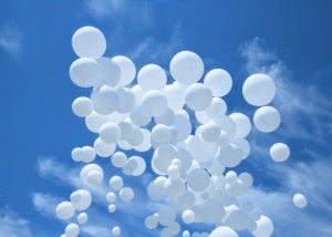 White balloons on the blue sky